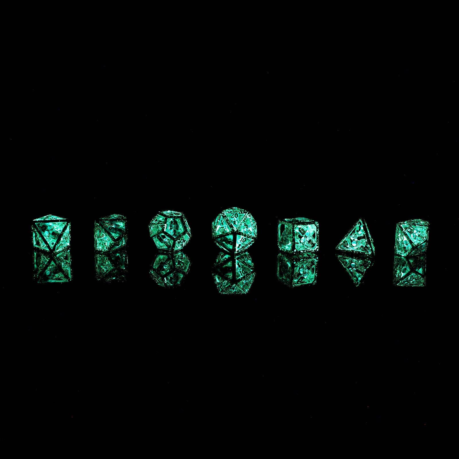 Skull's Grin Hollow Metal Dice Set - Glow in the Dark Blue