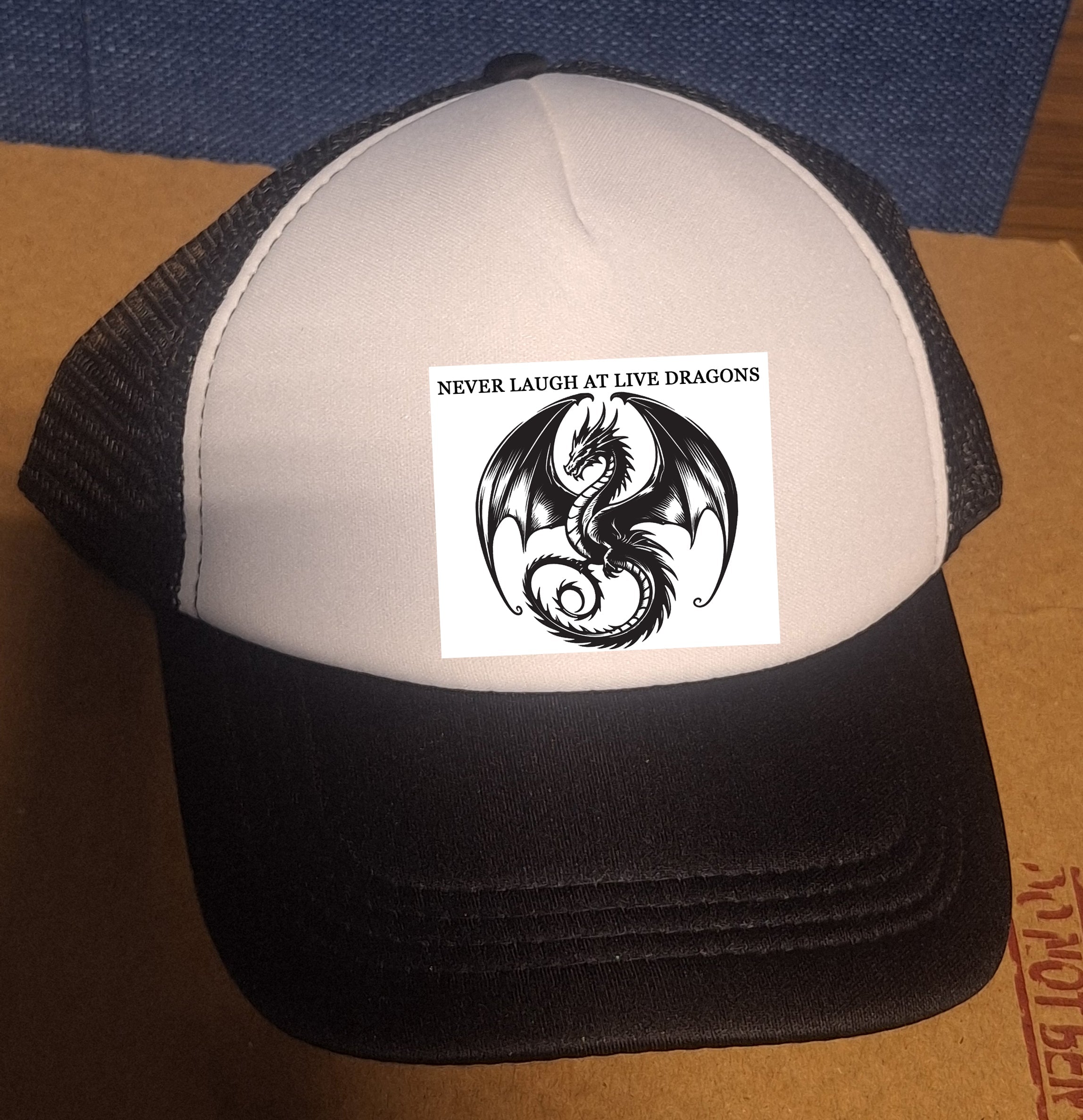 Adjustable Trucker Baseball Cap with "Never Laugh at Live Dragons" Embroidery