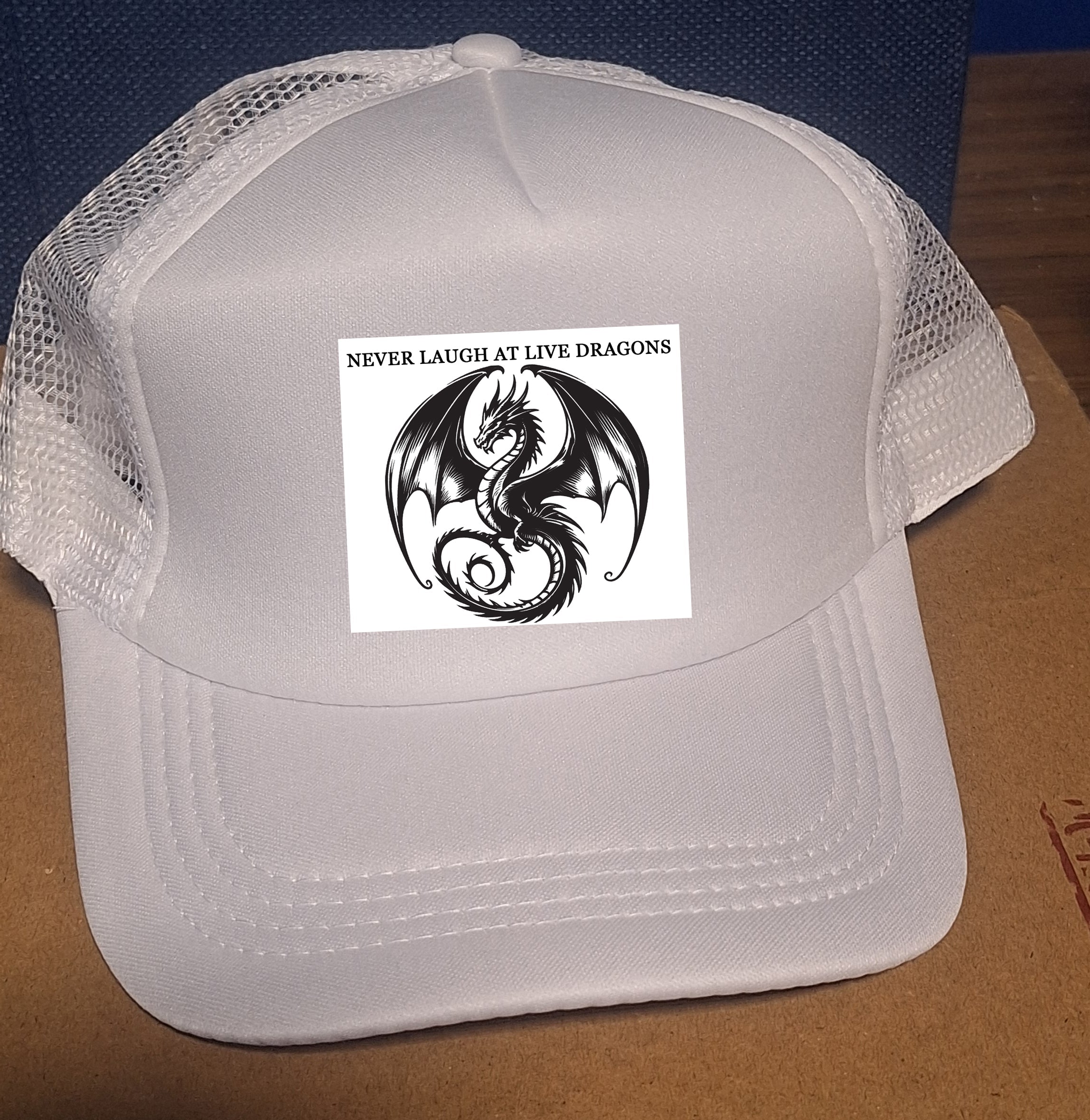 Adjustable Trucker Baseball Cap with "Never Laugh at Live Dragons" Embroidery